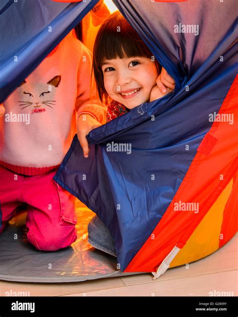 Children in living room playing hi-res stock photography and images - Alamy