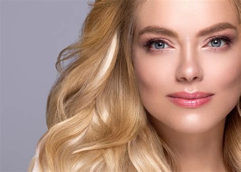 Premium Photo | Blonde face woman curly hair beauty face natural makeup . studio shot.