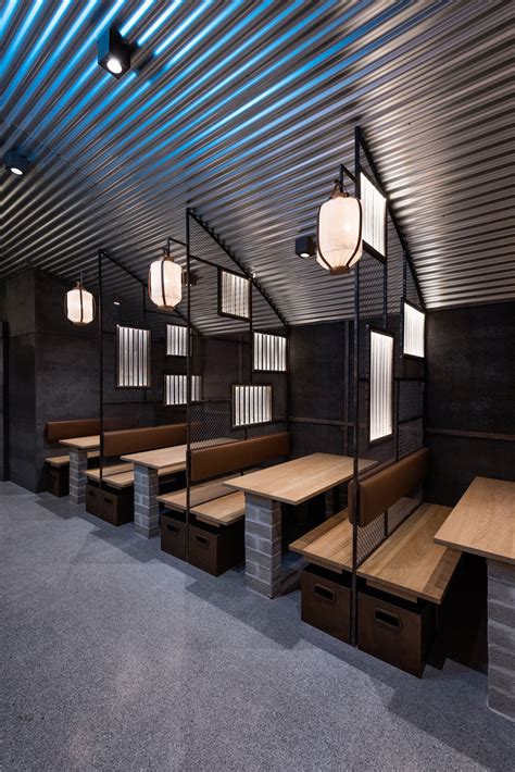 Industrial Interior Design - This Restaurant and bar goes for a warehouse chic style with metal ...
