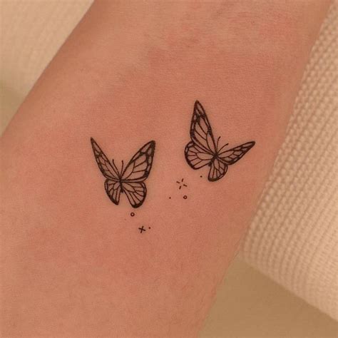 Fine line butterflies tattooed on the inner forearm | Butterfly tattoos ...