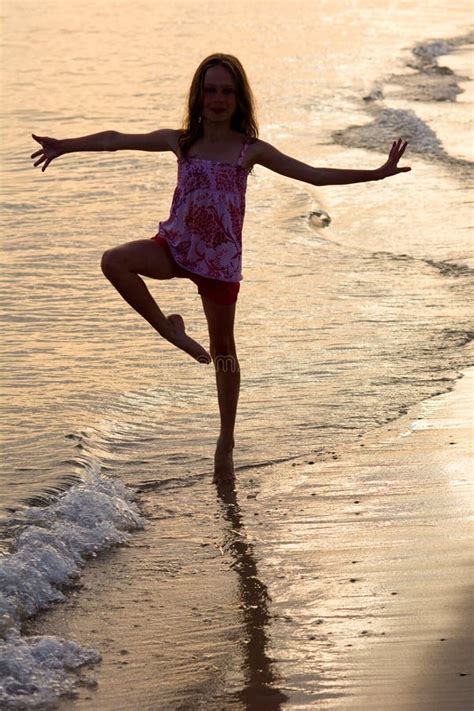 Happy Girl Dancing On The Beach At The Sunset Time Stock Image - Image of laughing, active: 75551851