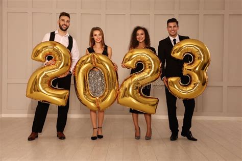 Happy Friends with Golden 2023 Balloons Indoors. New Year Celebration Stock Photo - Image of ...