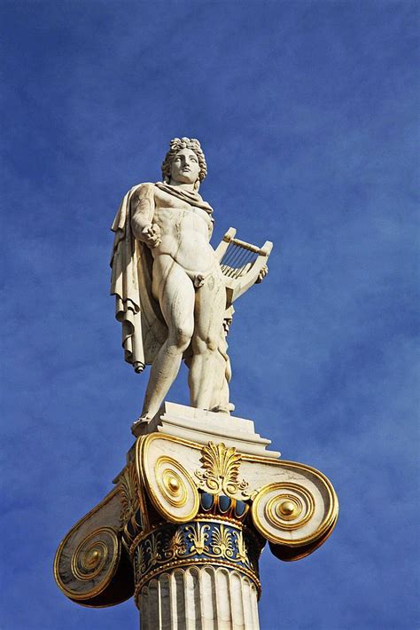 In front of the Athens Academy building the statue of Apollo the Lyra ...