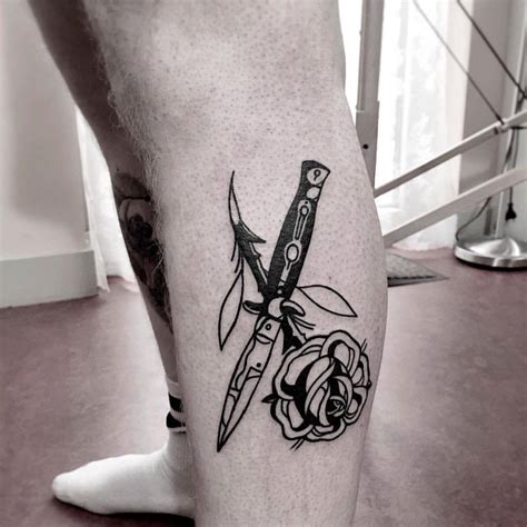 Switchblade and rose tattoo on the calf - Tattoogrid.net