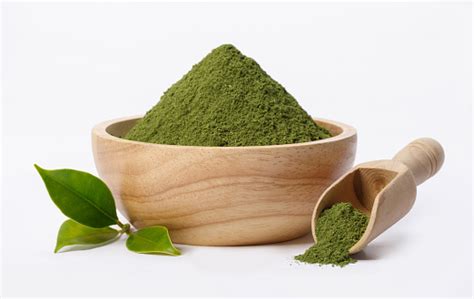 Matcha Green Tea Powder In Bowl With Organic Green Tea Leaf Isolated On ...