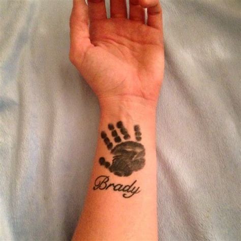 Unique Handprint Tattoo Ideas | Baby hand tattoo, Hand print tattoos ...