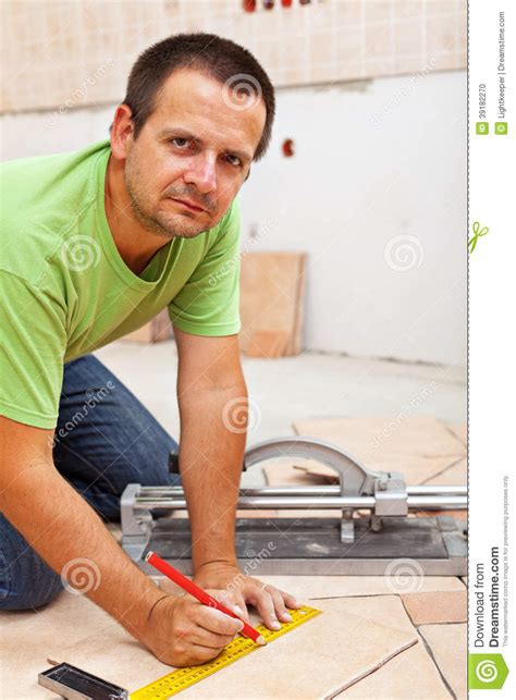 A Marking Tiles For Cutting With An Electric Tile Cutter Royalty-Free Stock Image ...