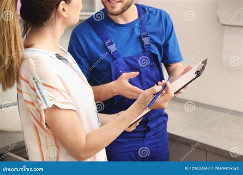 Professional Plumber in Uniform Talking To Client Stock Image - Image of people, piping: 123603243