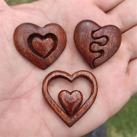 #handcarvedjewelry #woodenpendants #uniquejewelry #handmadejewelry #woodart #wearableart # ...