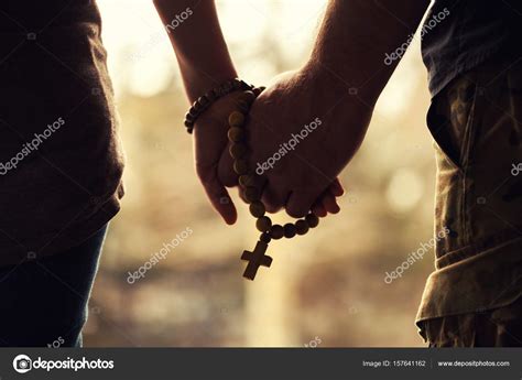 Picture: husband and wife praying together | Couple Praying Together Holding Rosary Hand — Stock ...