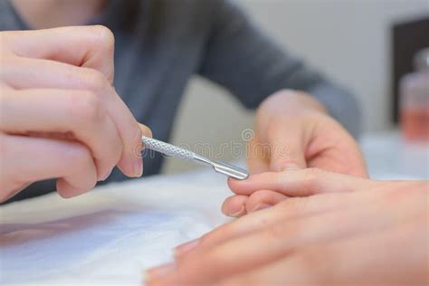 Use a Pusher for Manicure. Master Makes Manicure. Stock Photo - Image ...