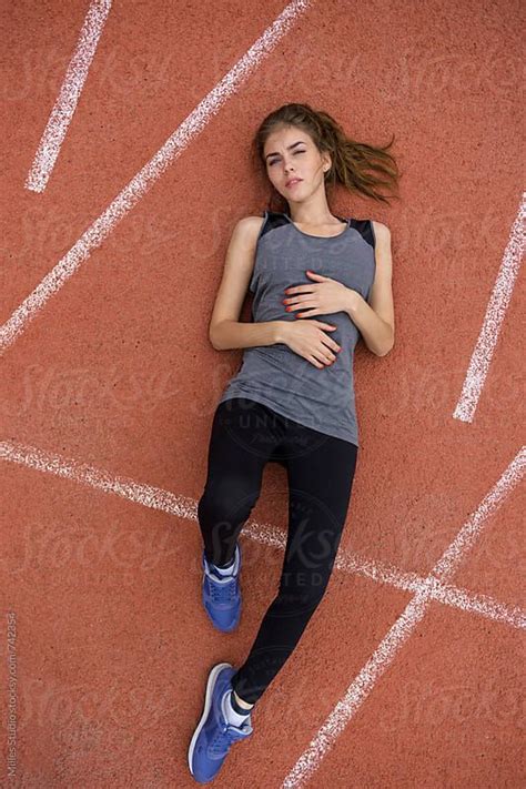 "Woman Laying On Track" by Stocksy Contributor "Milles Studio" | Pose ...