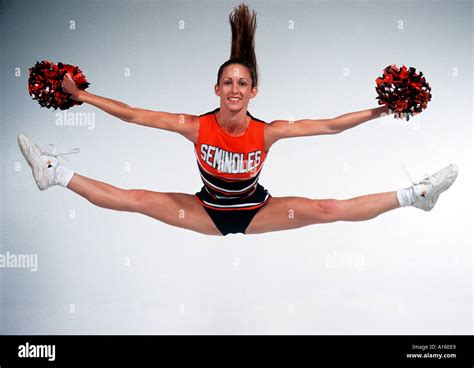 Excitement Cheerleader jumping doing a split Stock Photo: 93929 - Alamy