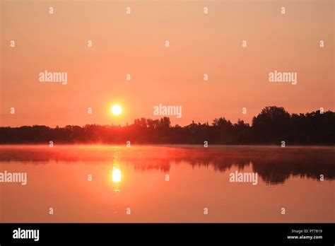Colorful rising sun Stock Photo - Alamy
