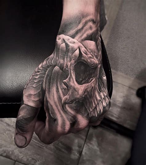 Horned Skull On Guys Hand | Best tattoo design ideas