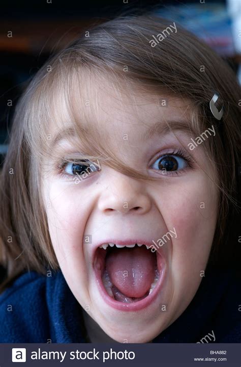 Happy child SHOUTING MOUTH OPEN happy children portraits Stock Photo, Royalty Free Image ...