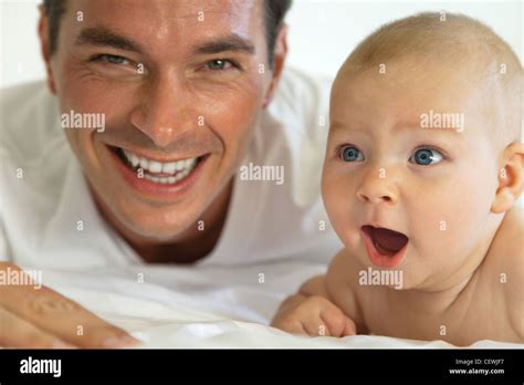 Father and baby laughing together, portrait Stock Photo - Alamy