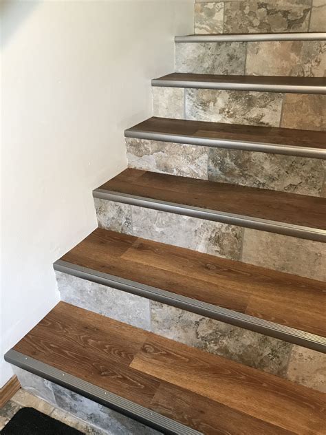 Luxury Vinyl Plank and Porcelain Tile Staircase Renovation