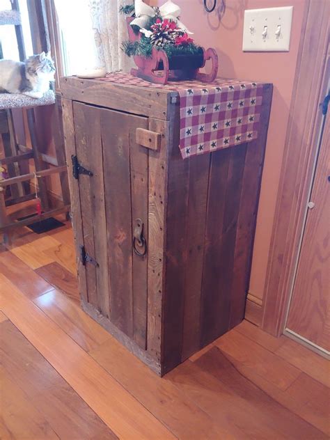 Jelly cabinet made from pallets. Scrap leather and old metal horse harness ring handle ...