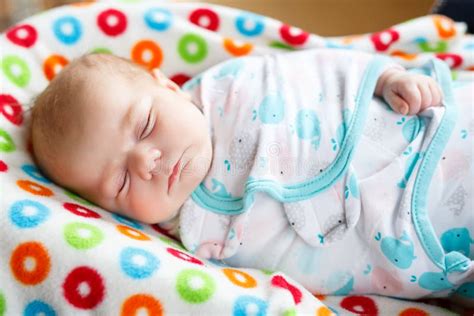 Cute Little Newborn Baby Girl Sleeping Wrapped in Blanket Stock Image ...