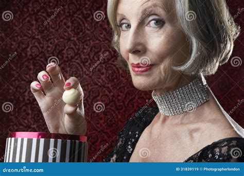 Wealthy Senior Woman with Candy Box Stock Image - Image of isolated ...