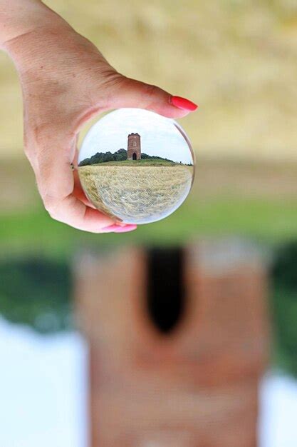 Premium Photo | Close-up of hand holding crystal ball