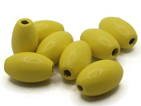 8 28mm Yellow Wooden Oval Beads | Michaels