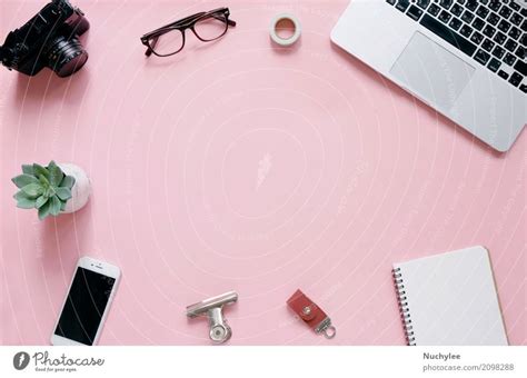 Creative flat lay of workspace desk, office stationery and lifestyle objects on pink background ...