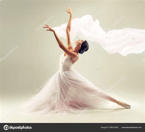 Woman Ballerina In White Long Skirt Posing On White Background Photo ...