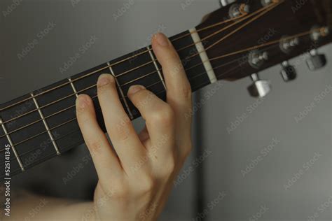 person playing guitar chord Stock Photo | Adobe Stock