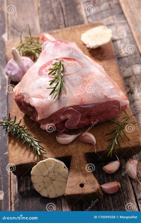 Raw lamb leg with rosemary stock photo. Image of meat - 170599328