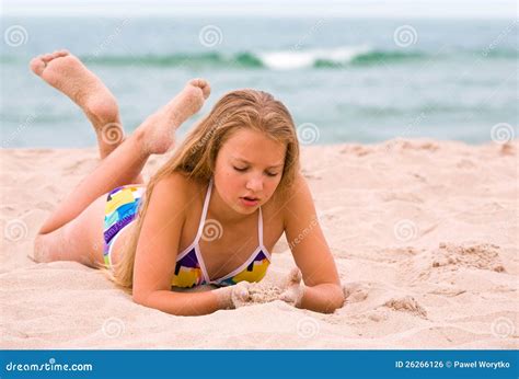 Young Girl Lay On The Beach Stock Photo - Image: 26266126