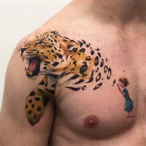 Watercolor leopard tattoo on the shoulder.