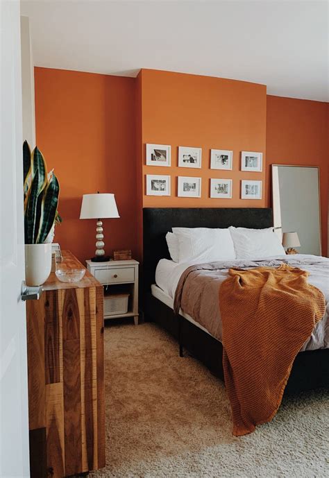 A Cozy Boho Rental Apartment Has the Perfect Terracotta-Colored Bedroom Wall | Orange bedroom ...