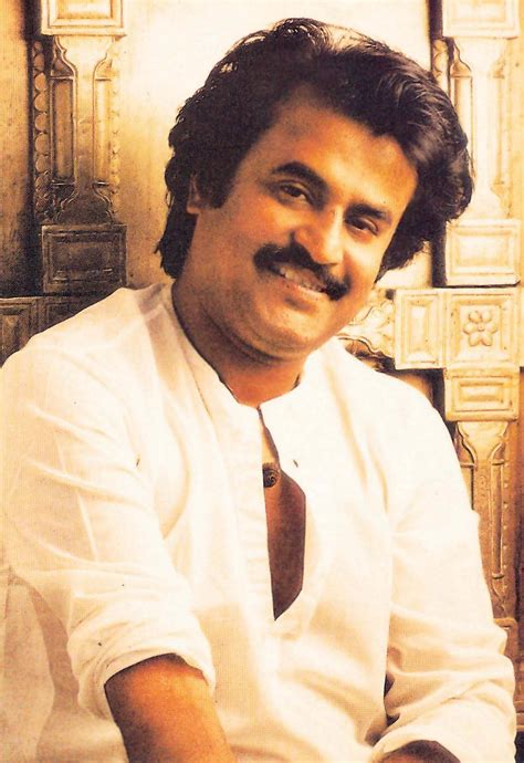 Download Rajinikanth Against Golden Wall Wallpaper | Wallpapers.com