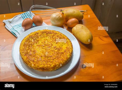 Spanish omelet with ingredients. Still life Stock Photo - Alamy