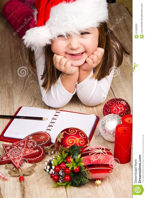 Funny Girl in Santa Hat Writes Letter To Santa Near Christmas ...