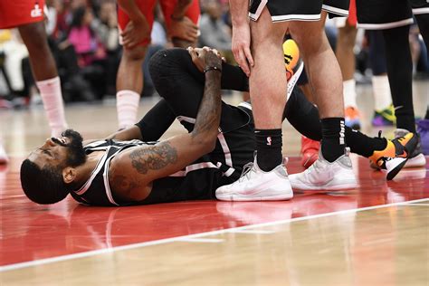 Kyrie Irving injures knee as Wizards top Nets - The Boston Globe