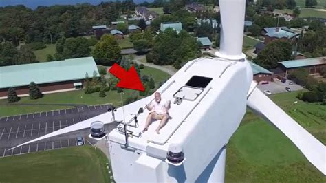 Crazy Sunbather -- Drone Spots Guy Tanning On Windmill!!!