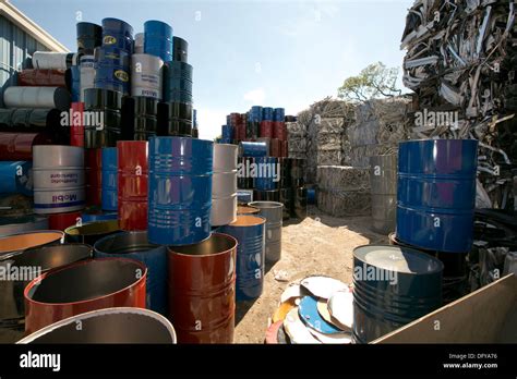 Metal oil barrels brought into scrap metal recycling yard in Texas Stock Photo: 61451690 - Alamy