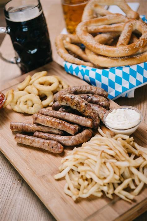 Fried Sausages, Onion Rings, French Fries, Pretzels Free Stock Photo ...