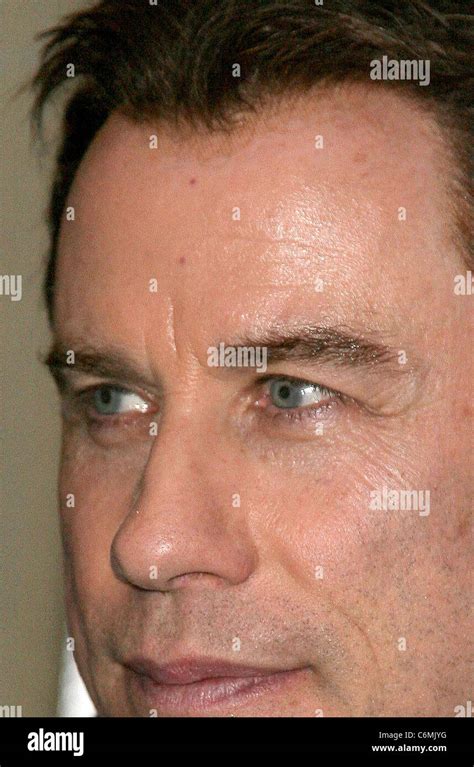 John Travolta seen with a visible mesh hairline while leaving Le Meurice Hotel Paris, France ...