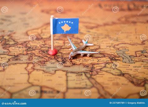 The Flag of the Republic of Kosovo and the Plane on the World Map Stock ...