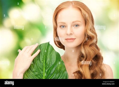 woman with green leaf Stock Photo - Alamy