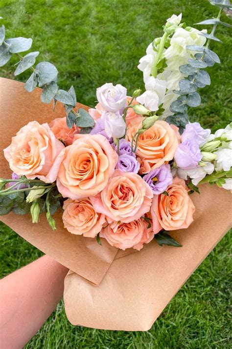 Bouquet with peach roses, lavender lisianthus, white snapdragon ...