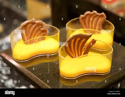 Mango cream Chocolate dessert in buffet restaurant Stock Photo - Alamy