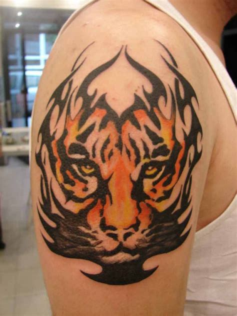 Tribal fire tiger tattoo on right arm | Tats | Tiger tattoo design ...