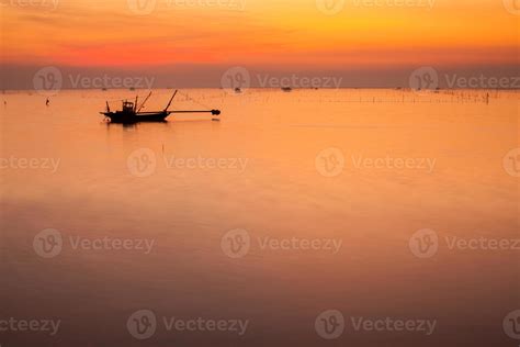 Silhouette of a fishing boat at sunset 2009911 Stock Photo at Vecteezy