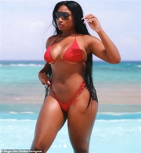 Megan Thee Stallion shows off her famous curves in cherry red thong bikini as she declares she ...