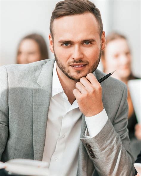 Close Up. Brooding Entrepreneur Sitting at Office Desk Stock Image ...